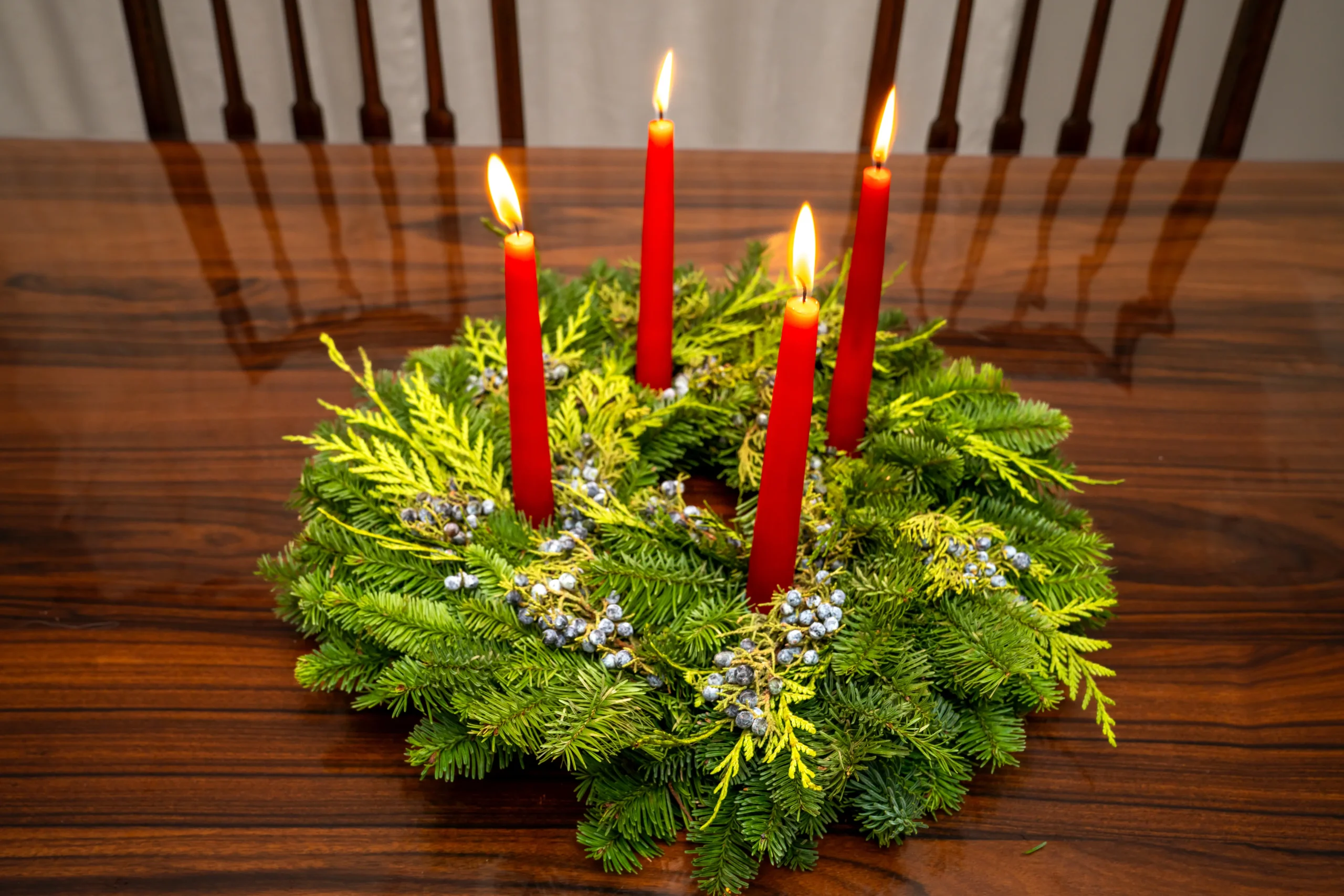 adventről wreath candles greenery symbolizing seasonal anticipation hope warmth tradition celebration home decoration spiritual preparation festive atmosphere