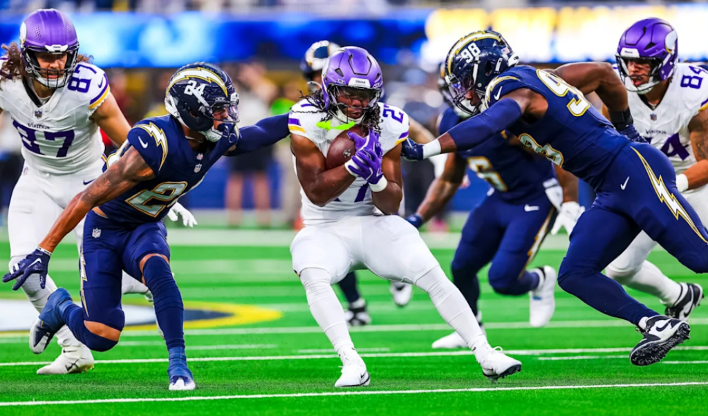 Minnesota Vikings vs Chargers match player stats action showing quarterbacks passing and defenders reacting