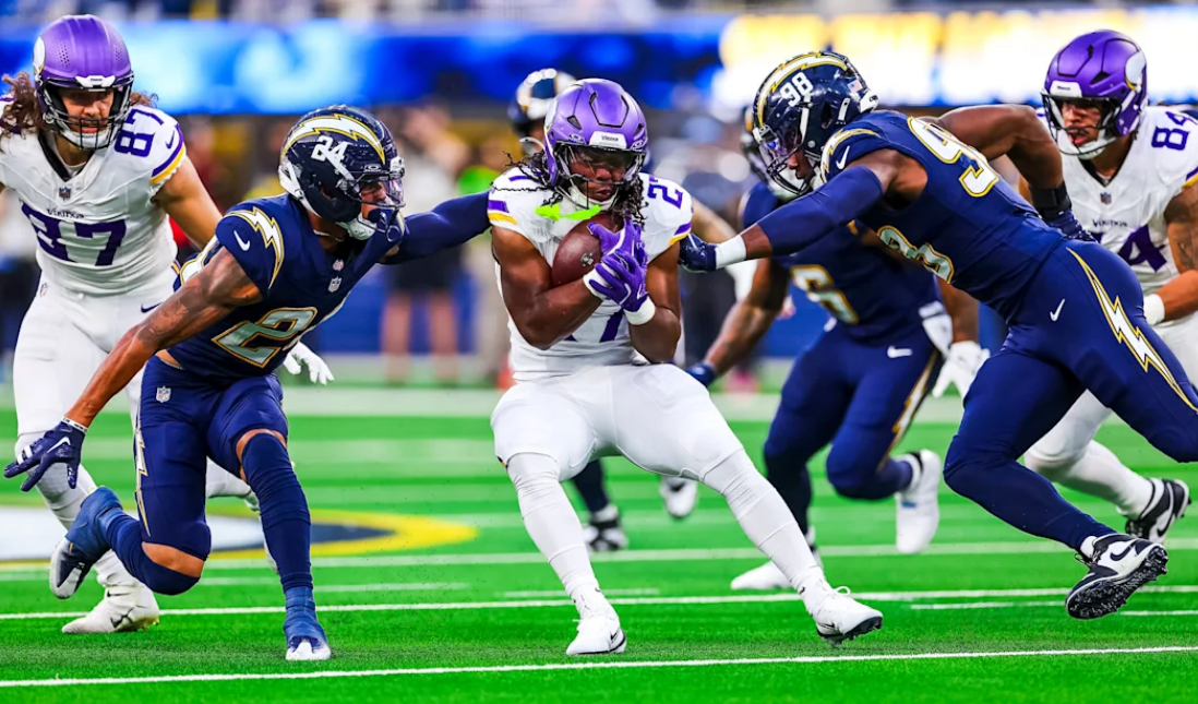 Minnesota Vikings vs Chargers match player stats action showing quarterbacks passing and defenders reacting