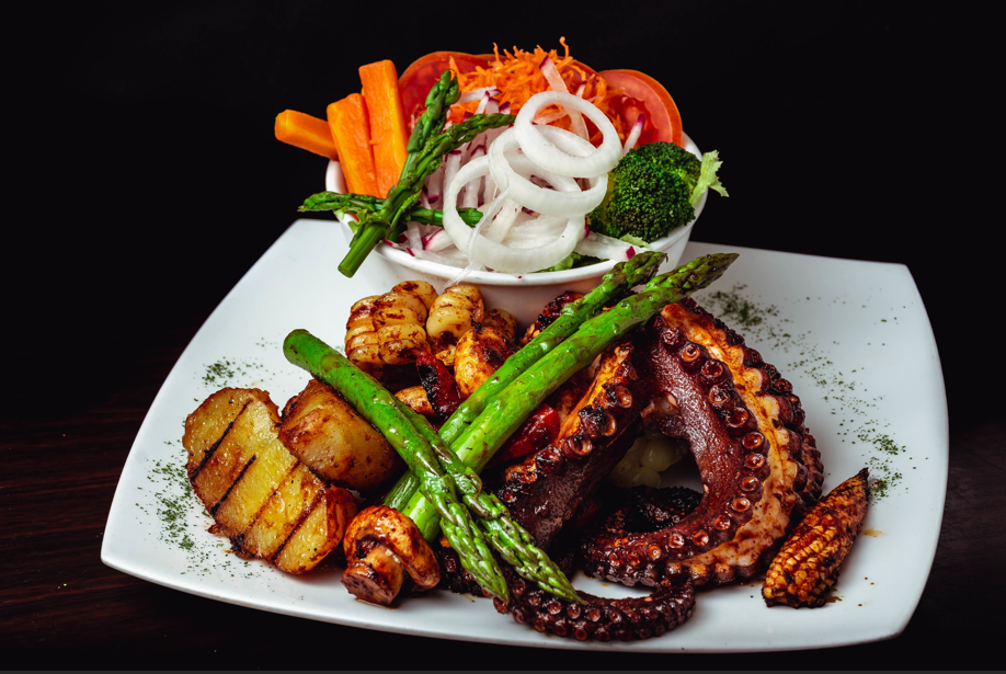 Artistic calamariere seafood dish with modern plating