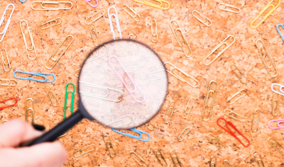 What is a magnifying glass used for while reading small print and inspecting tiny objects